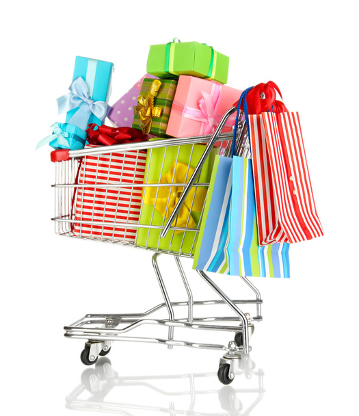 Christmas gifts and shopping in trolley isolated on white - Zdjęcie, obraz