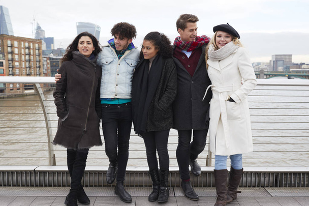 Group Of Young Friends Visiting London In Winter - 写真・画像