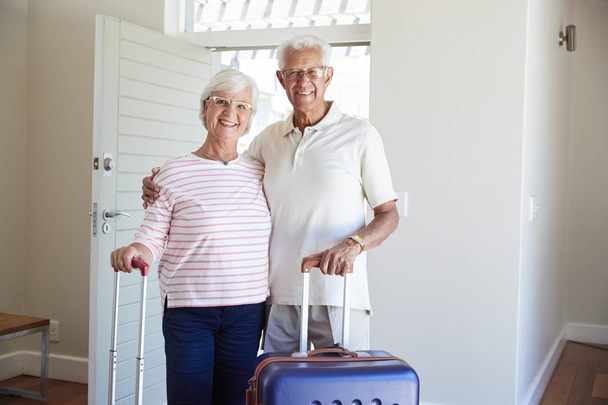 Portrait Of Senior Couple Arriving At Summer Vacation Rental - Photo, image
