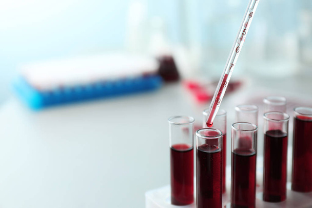 Dripping blood into test tubes, closeup - Fotoğraf, Görsel