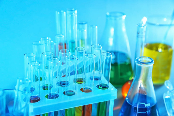 Test tubes with colorful liquids in holder, closeup - Photo, Image