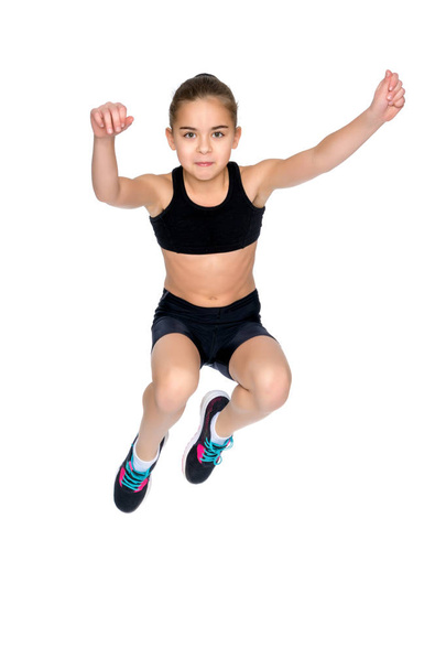 Girl gymnast jumping. - Zdjęcie, obraz