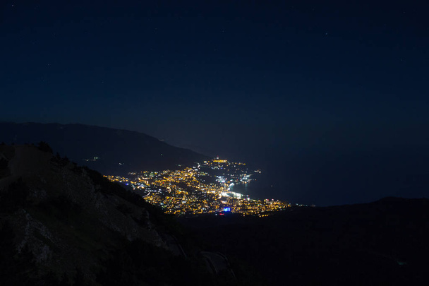 Stunning views of the night city from Mount Ai-Petri peninsula Crimea. - Photo, Image