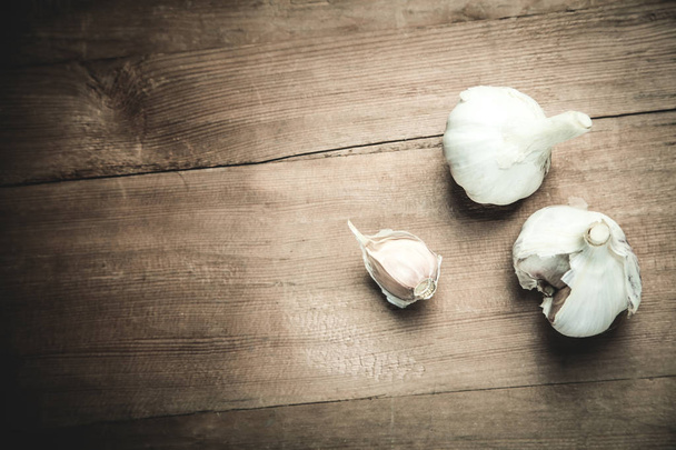 Garlic on the wood table. - Photo, Image