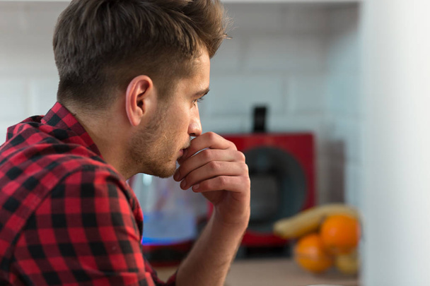 Young Businessman working at home in plaid shirt - Photo, Image