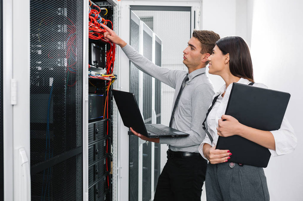 IT expert checking supercomputer server - Photo, Image