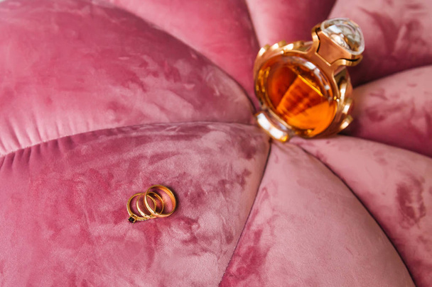 the original soft pink armchair and the perfume and rings that l - Photo, Image
