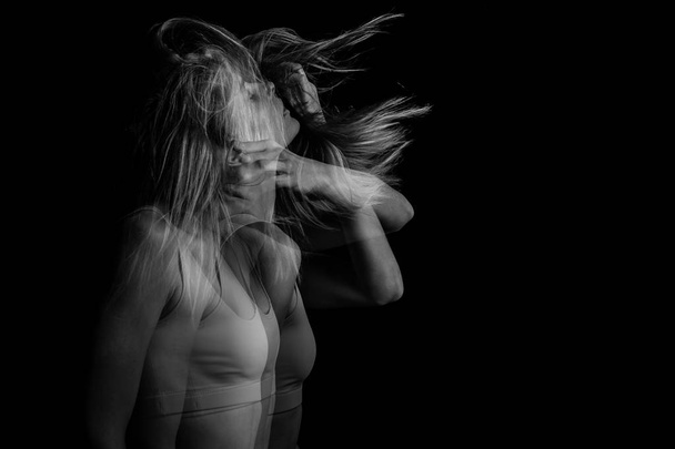 Mystical sensitive emotional portrait of a young girl in motion. Black and white photo. triple exposure. - 写真・画像