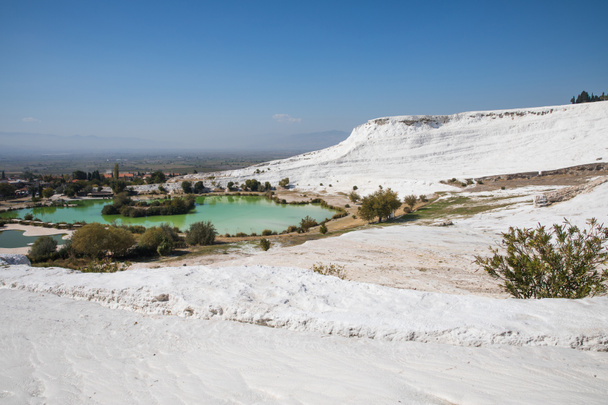 majestic landscape with famous white geological formations and pool in pamukkale, turkey - Photo, Image