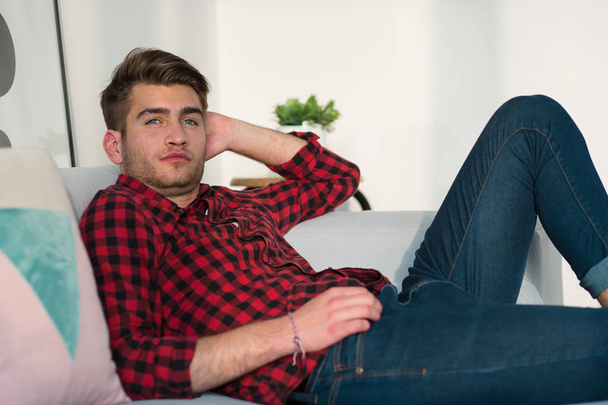 Young Businessman working at home in plaid shirt - Fotografie, Obrázek