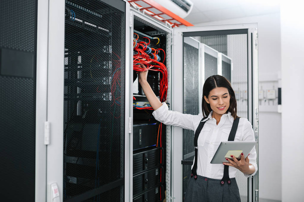 IT expert checking supercomputer server - Photo, Image