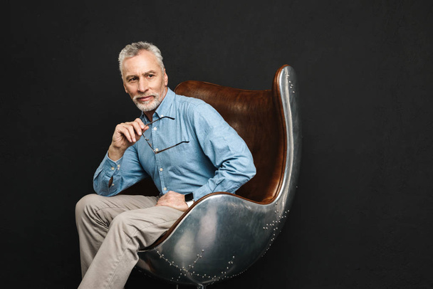 Image of businesslike gentleman 50s with grey hair and beard in  - Фото, зображення