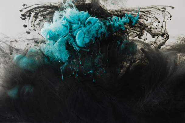 close up view of mixing of light gray, turquoise and black paints splashes in water isolated on gray - Fotoğraf, Görsel