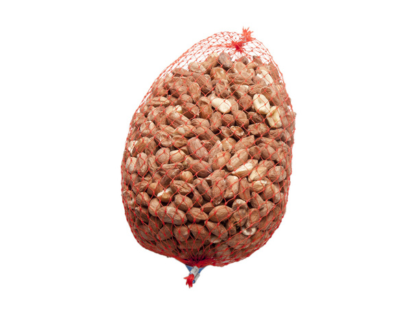 A net including nuts with a white background - Photo, Image