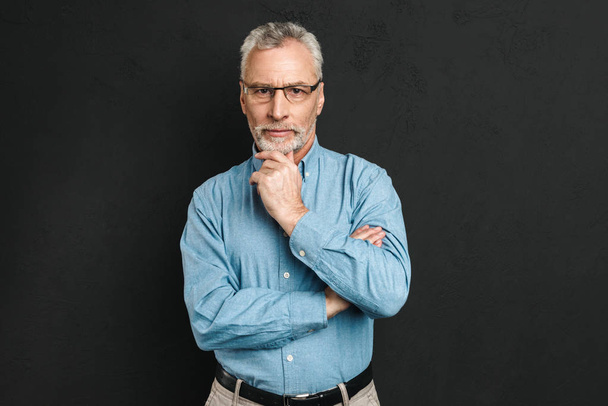 Portrait of a thoughtful mature man dressed in shirt - Foto, Imagem