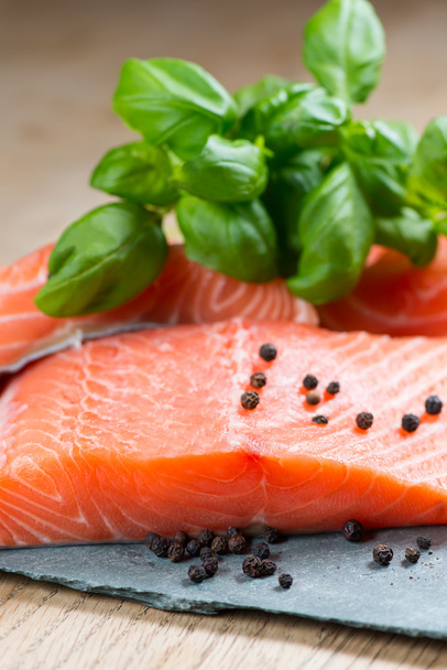 Fresh salmon with basil and pepper - Фото, изображение