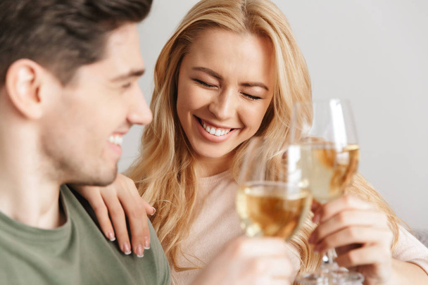 Happy young loving couple drinking alcohol white wine champagne. - Foto, Imagen