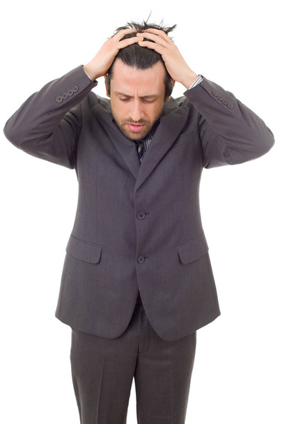 Επιχειρηματίας σε ένα κοστούμι χειρονομίες με πονοκέφαλο, απομονωμένη - Φωτογραφία, εικόνα