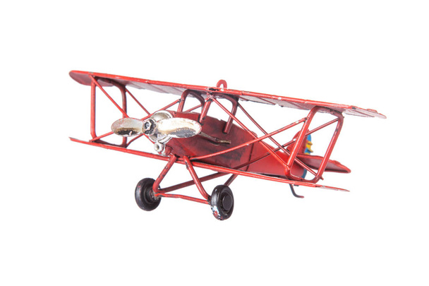 piros játék repülőgép arc elszigetelt - Fotó, kép