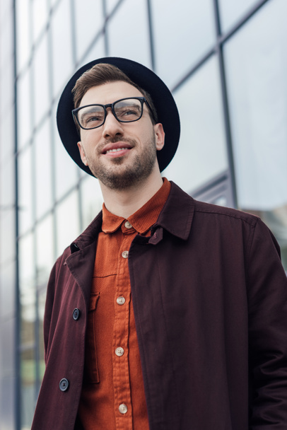 handsome stylish man posing in glasses and hat   - Φωτογραφία, εικόνα