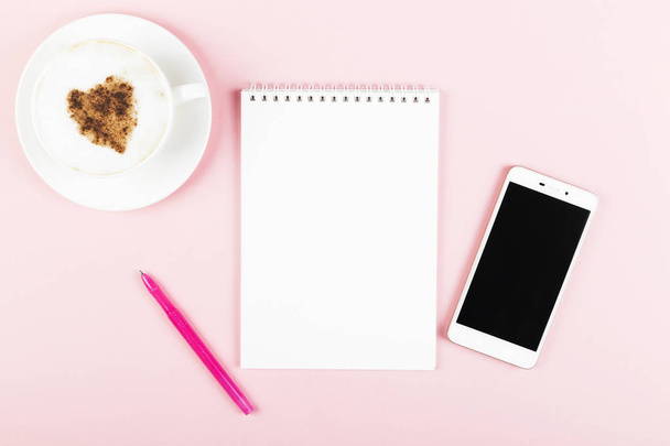 Concept morning planning - cappuccino, notebook, pen, phone on p - Фото, изображение