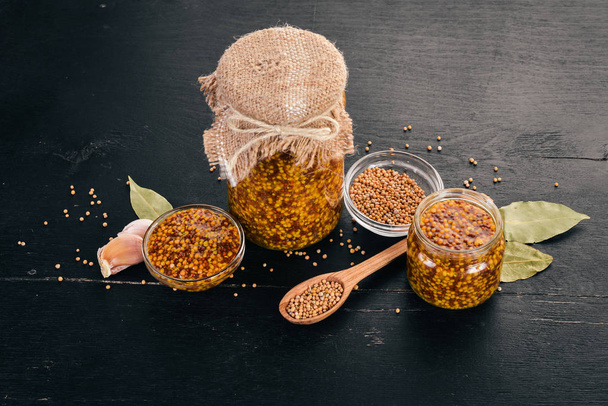 Grain Mustard. Spices On a dark wooden background. Top view. Copy space for your text. - Fotografie, Obrázek
