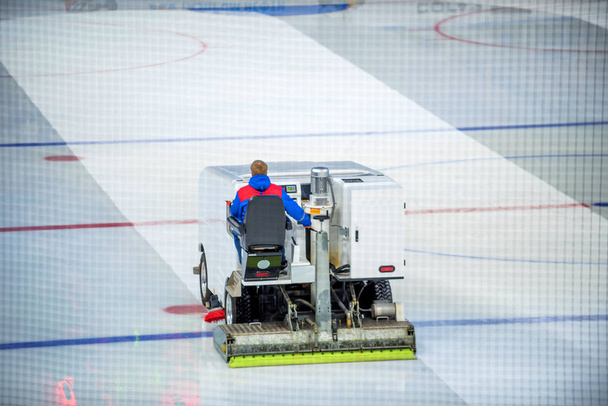 Resurfacing machine cleans ice of hockey rink - Photo, Image