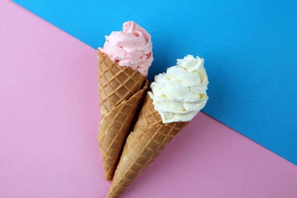 Vanilla frozen yogurt or soft ice cream in waffle cone. - Valokuva, kuva