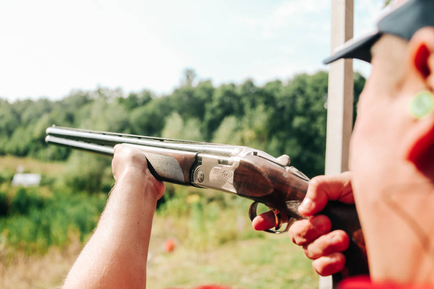 sports shooting plates targets hunter aiming shotgun - Фото, изображение