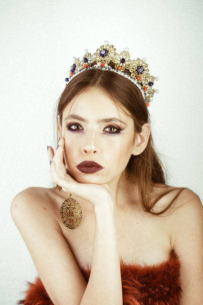 Makeup for woman with soft skin, elegance. Cosmetics for makeup and skincare, hairdresser. Fashion girl with elegant look. Beauty queen and fashion. Luxury of woman in crown and earrings jewelry. - 写真・画像