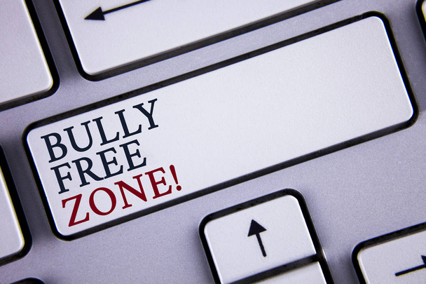 Word writing text Bully Free Zone Motivational Call. Business concept for creating abuse free school college life written on White Keyboard Key with copy space. Top view. - Foto, Bild