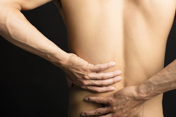 man touching his back for the pain - Photo, Image