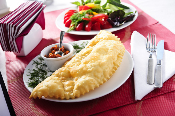 Picture of cheburek wit red sauce ,traditional eastern food - Photo, Image