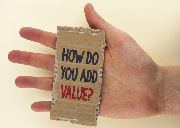 Conceptual hand writing showing How Do You Add Value Question. Business photo text Bring business progress contribute earn written on Tear Cardboard Piece on the plain background Hand. - Photo, Image
