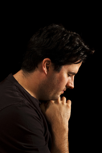 Молодий чоловік молиться
 - Фото, зображення