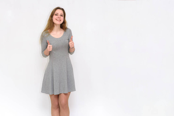 beautiful  girl on a white background in different poses - Valokuva, kuva
