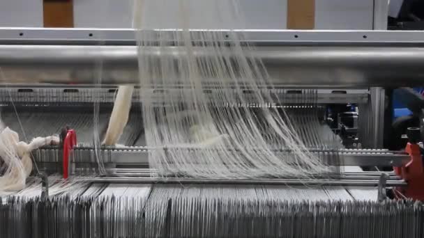 weaving loom at a textile factory, closeup. industrial fabric production line. the damage to the equipment. the camera is stationary - Footage, Video