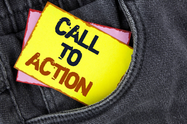 Writing note showing  Call To Action. Business photo showcasing most important part of online digital marketing campaign written on Yellow Sticky Note Paper placed on the Jeans background. - Photo, Image