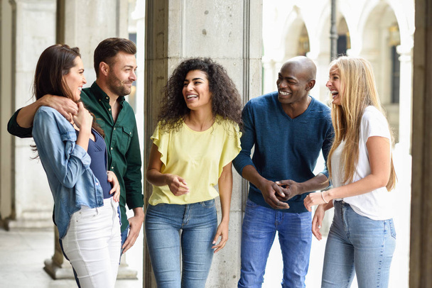 Multi-ethnic group of friends having fun together in urban backg - Photo, Image