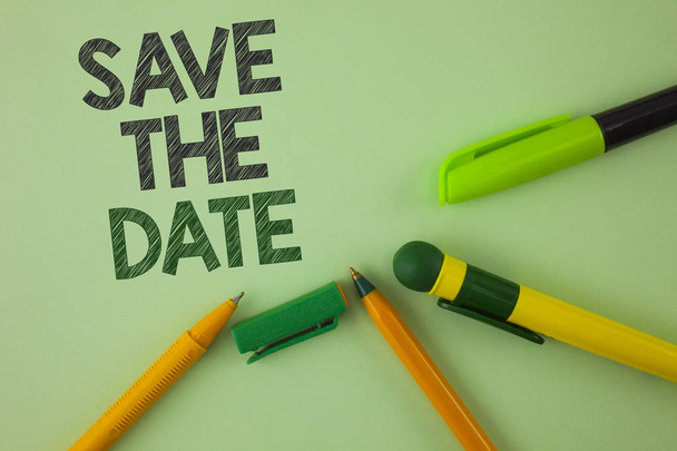 Handwriting text writing Save The Date. Concept meaning Organizing events well make day special by event organizers written on Plain Green background Pens next to it. - Photo, Image