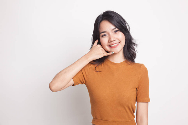 Young Asian woman show with phone gesture. - Fotoğraf, Görsel