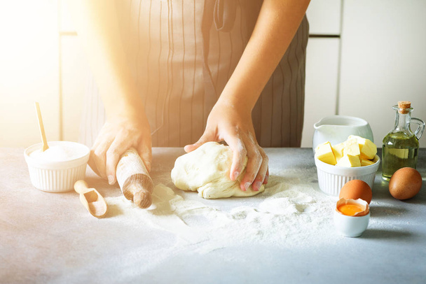 Heart of flour. Baking background with rolling pin, eggs, milk, butter on white kitchen table. Valentines day cooking, love concept. - Foto, Imagem