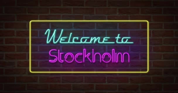 neonfarbenes Willkommensschild für Stockholm im Backsteinhintergrund - Filmmaterial, Video