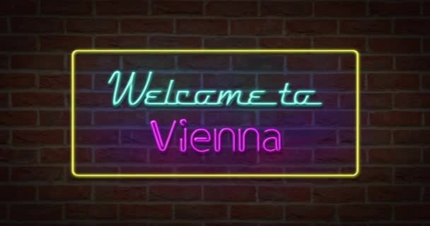 Neon znak tekstu Zapraszamy do Wiednia w tle Cegła - Materiał filmowy, wideo