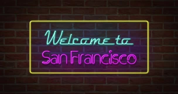 neonfarbenes Willkommensschild für San Francisco im Backsteinhintergrund - Filmmaterial, Video