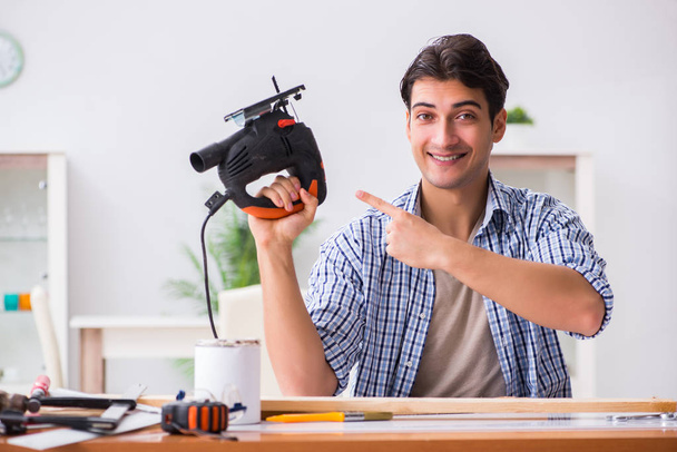 Young man in woodworking hobby concept - Photo, Image