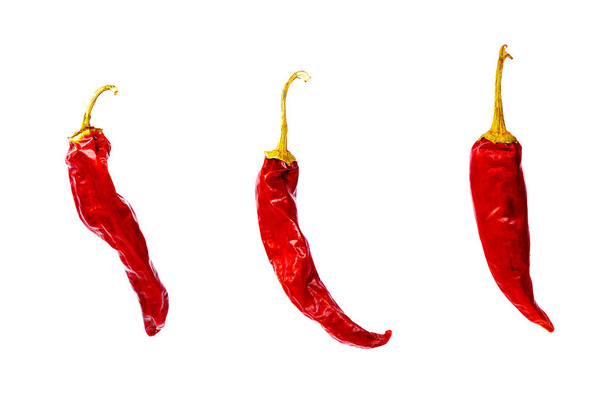 Red hot dry burning peppers isolated on white - Photo, Image