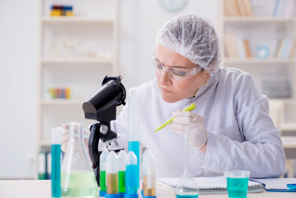 Woman chemist working in hospital clinic lab - Фото, изображение