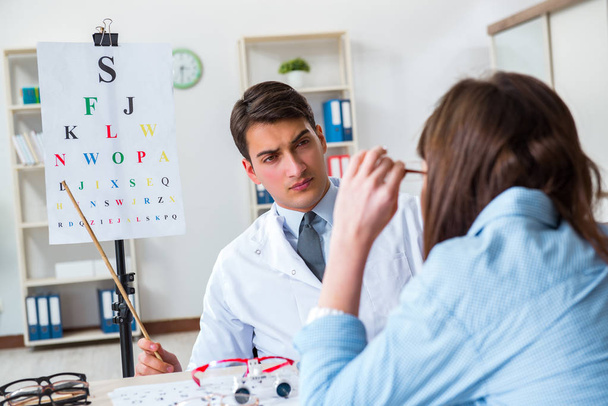 Doctor with patient at eye exam - Photo, Image