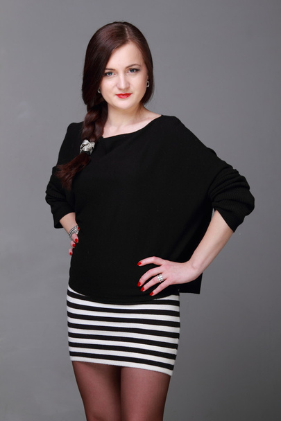 Portrait of a beautiful girl in a striped skirt - Fotografie, Obrázek